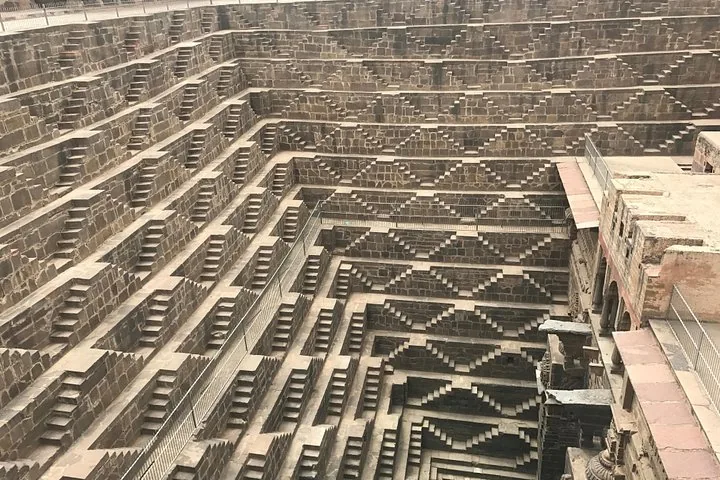 Looking down into the deep, intricate stair patterns of Chand Baori stepwell